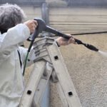 Damin nettoyant façade avec eau à haute pression